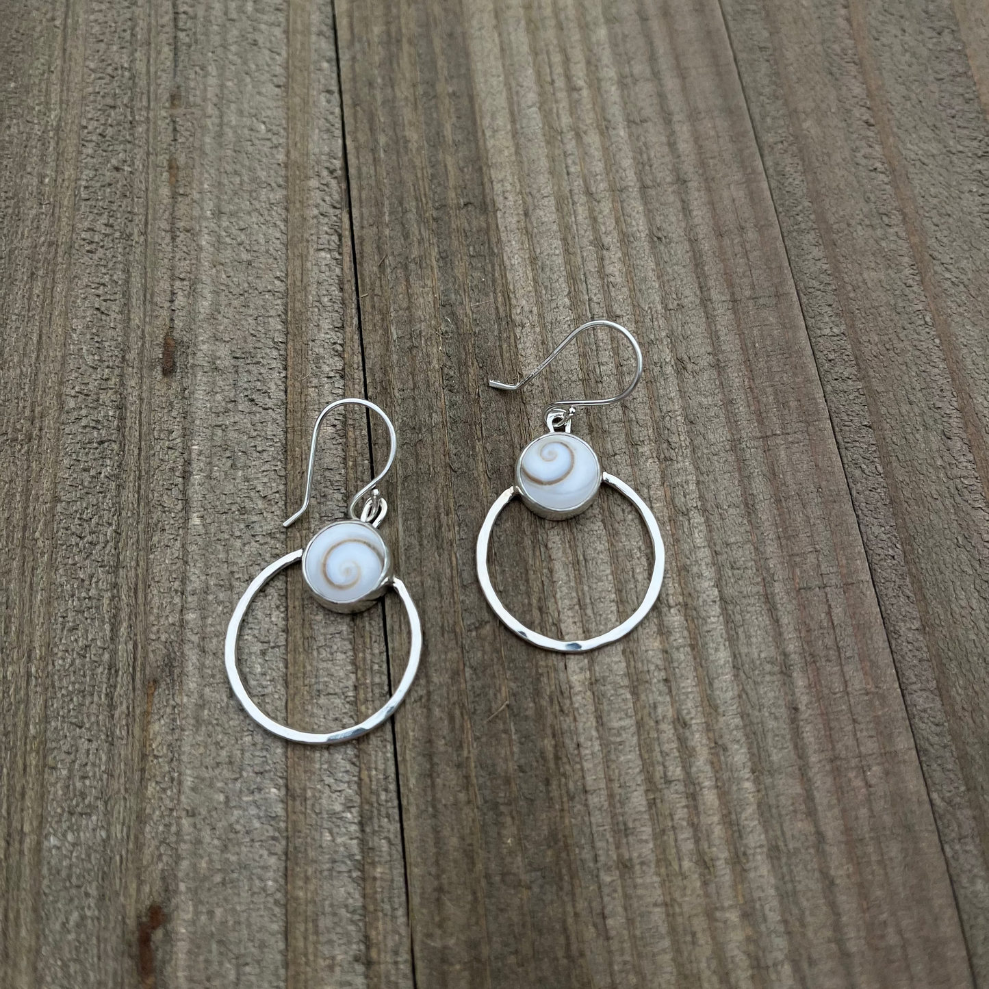 Sterling Silver hoop earrings with shiva shells and a hammered finish