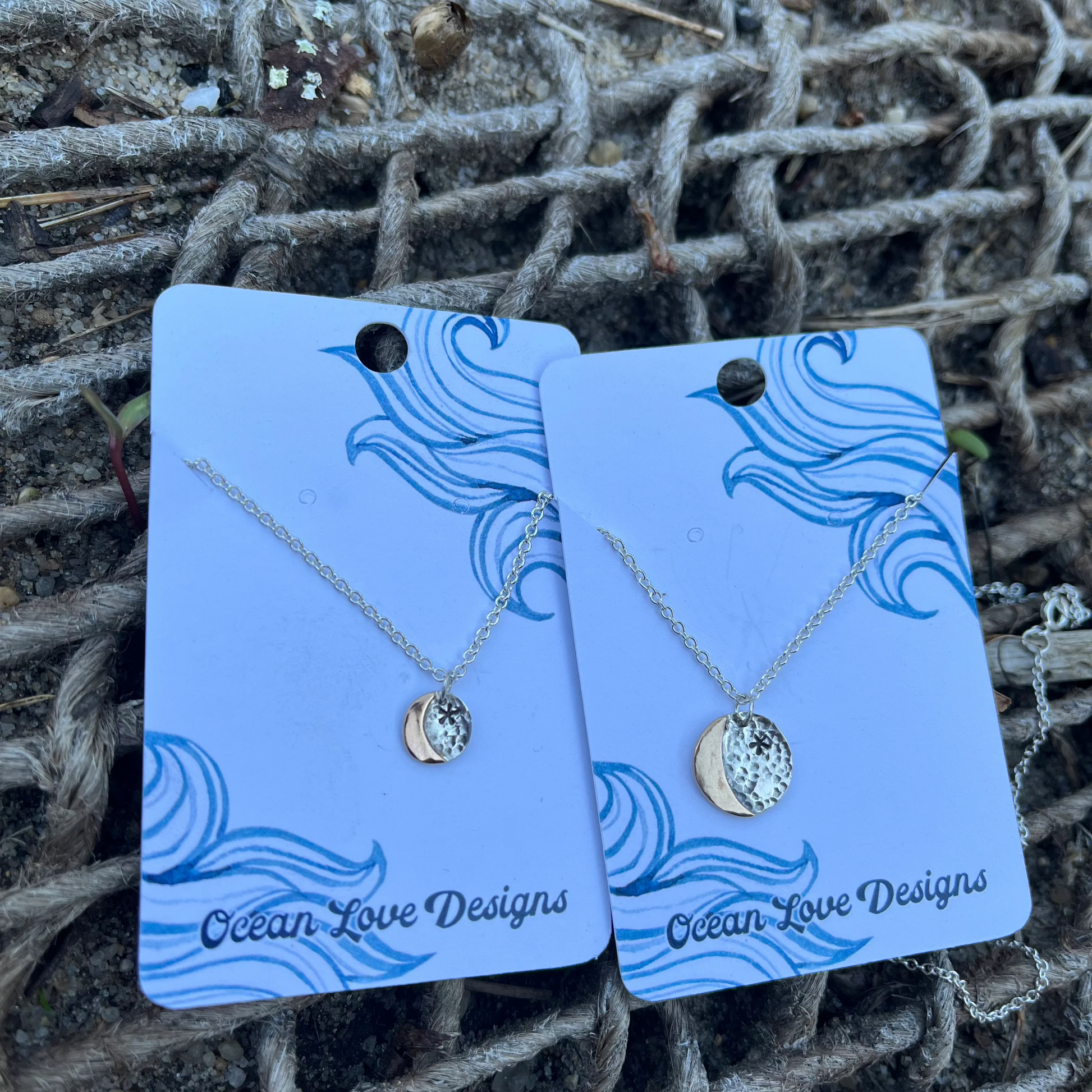 Tiny gold moon on silver back