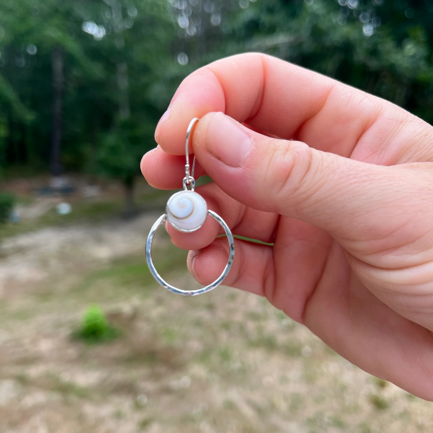 Sterling Silver hoop earrings with shiva shells and a hammered finish