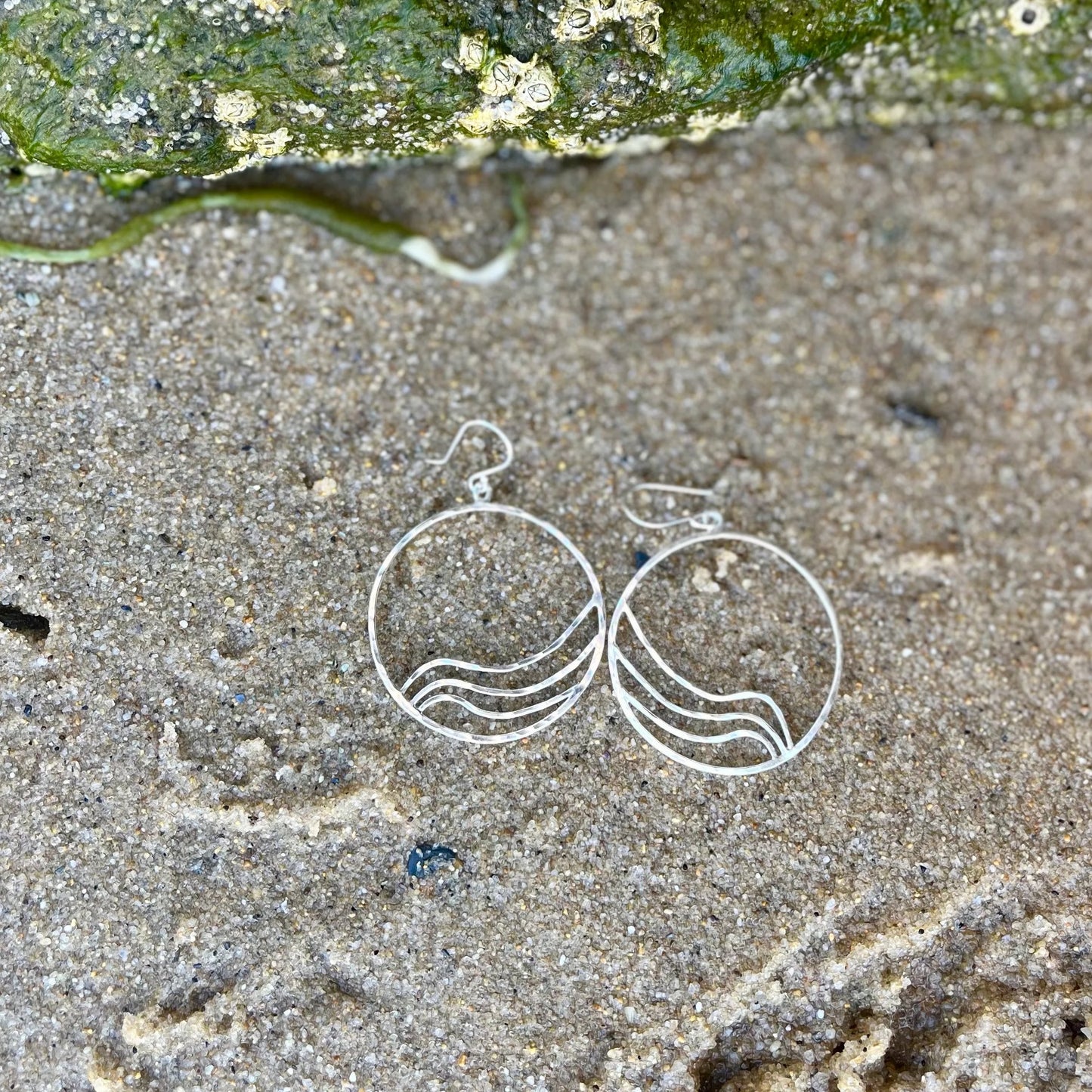 Sterling silver hoop earrings with ripple wave design