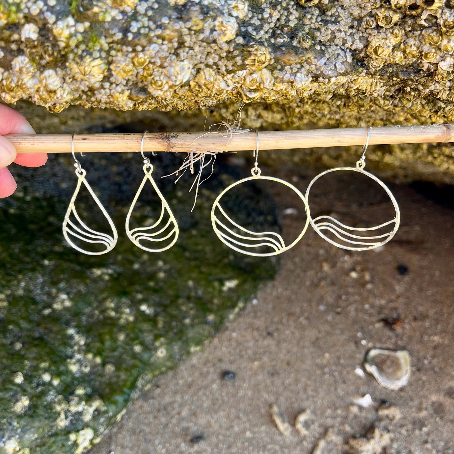 Sterling silver hoop earrings with ripple wave design
