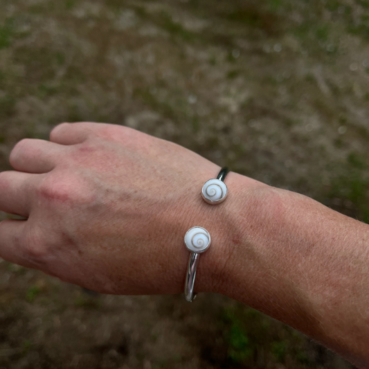 handcrafted sterling silver cuff bracelet with shiva shell cabochons by Ocean love designs